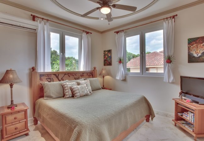 one off the bedroom at the luxurious villa solemar at belizean cove estate