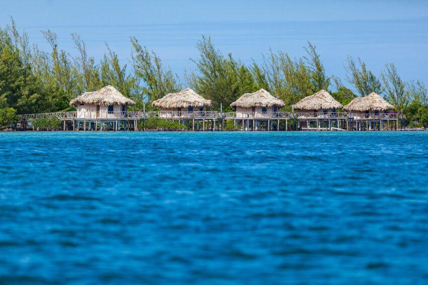 over the water cabanas at thatch caye private island belize
