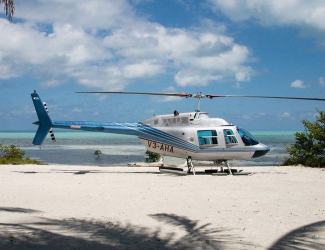 belize helicopters transfers belize helicopters on the beach waiting for clients