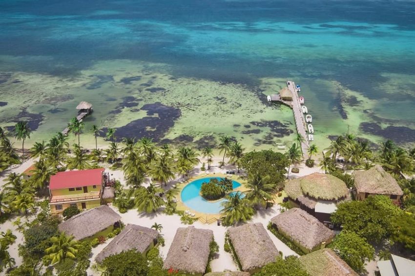Portofino Beach Resort, A San Pedro Resort aerial view of the cabanas, pool and dock at portofino beach resort on ambergris caye in belize