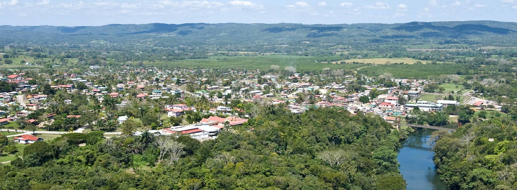 the macal river surrounded by jungle and the town of san ignacio in belize