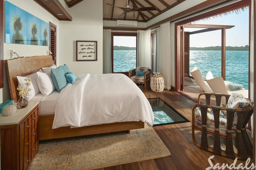 a look inside the bedroom of the over the water bungalow in the caribbean at sandals south coast