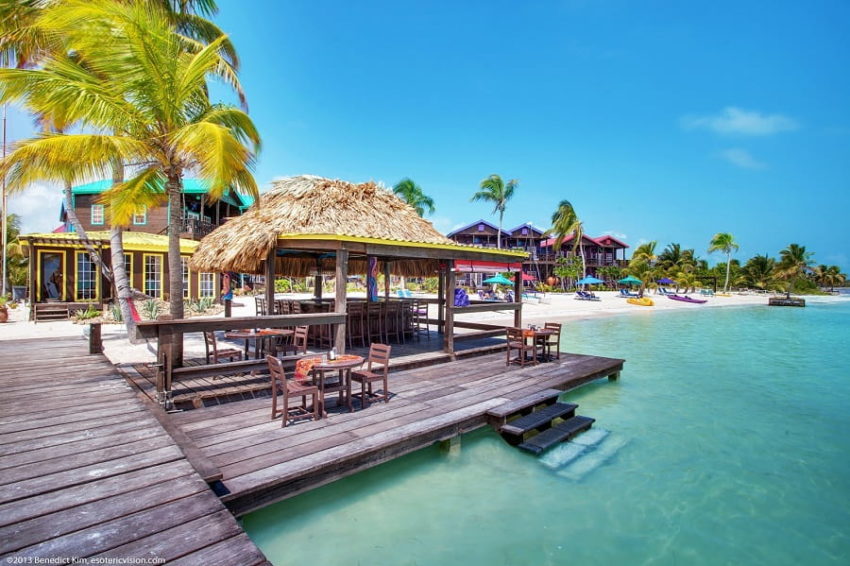 X'tan Ha "The Waterfront", A San Pedro Resort view of the over the water bar and beach at xtan ha resort on ambergris caye in belize