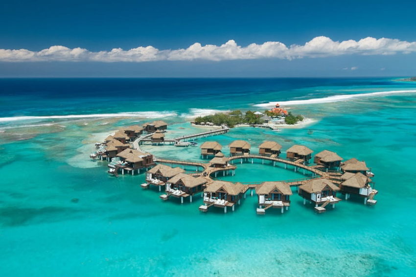 aerial of the private island and over the water villas/bungalow at sandals royal caribbean in jamaica