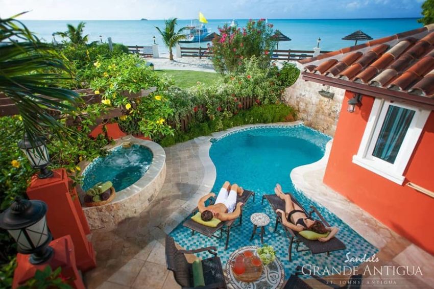 guests relaxing at the private pool of the Mediterranean One Bedroom Butler Villa with Private Pool Sanctuary room at sandals antigua