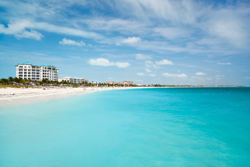 cyrstal clear blue caribbean sea and the white sandy beach in turks & caicos in the caribbean