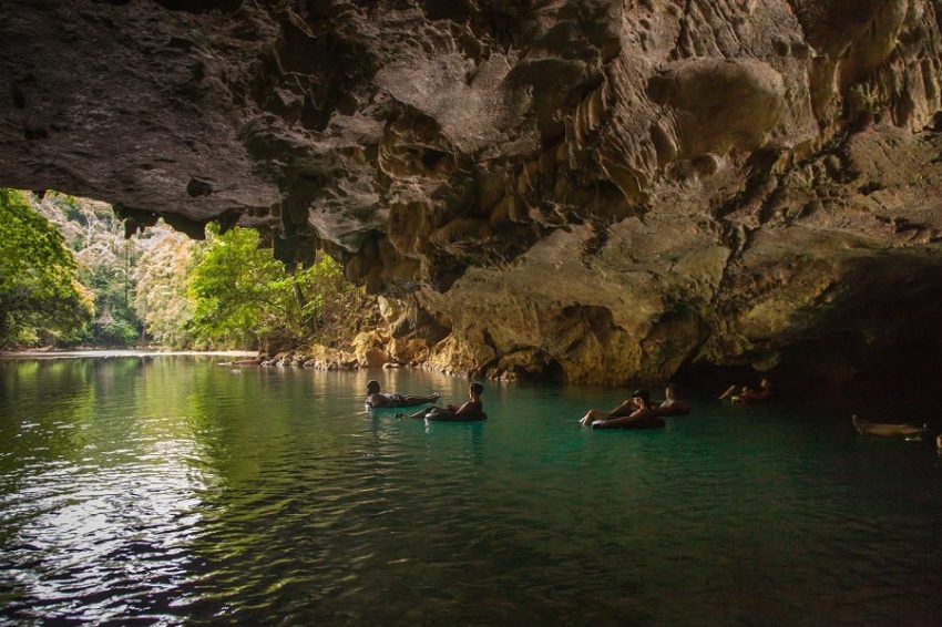 cave tubing, belize guests tubing to the exit of the cave at cave branch belize