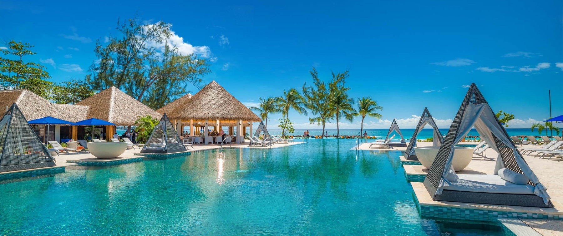 the pool with swim upbar and beach at sandals royal barbados in barbados